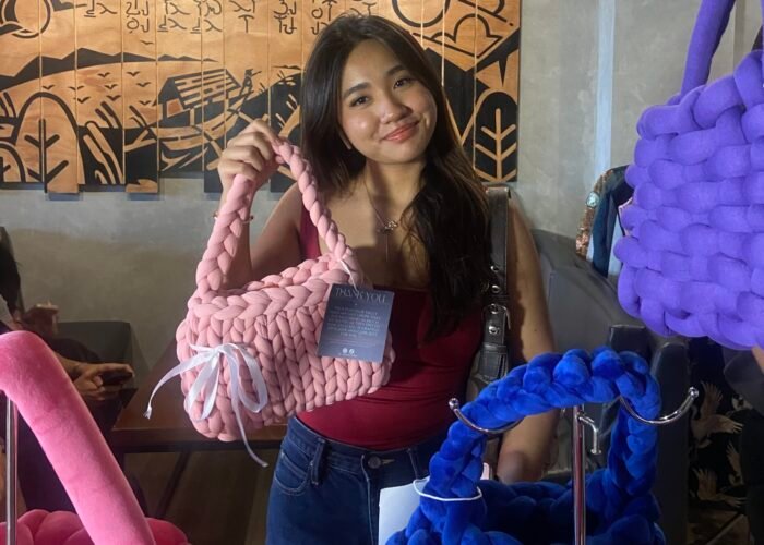 Customer Purchasing Bag in Pop-up Booth
