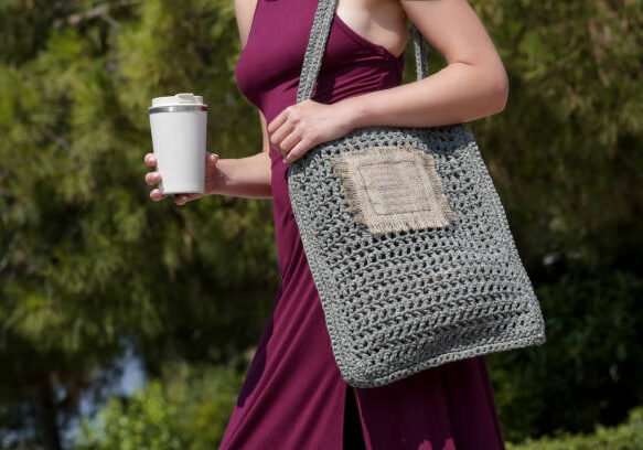 istockphoto-1458169452-612x612 Woman carrying a uniquely patterned Crochet Bag